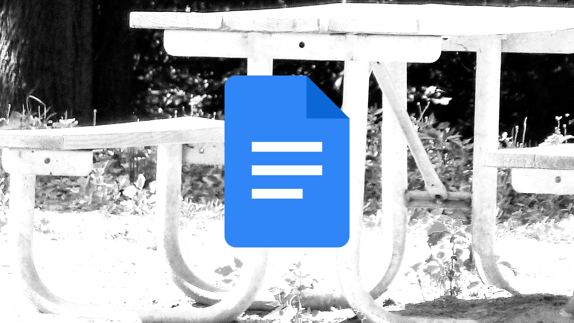 O logotipo do Google Docs com uma imagem em preto e branco de uma mesa de piquenique ao fundo