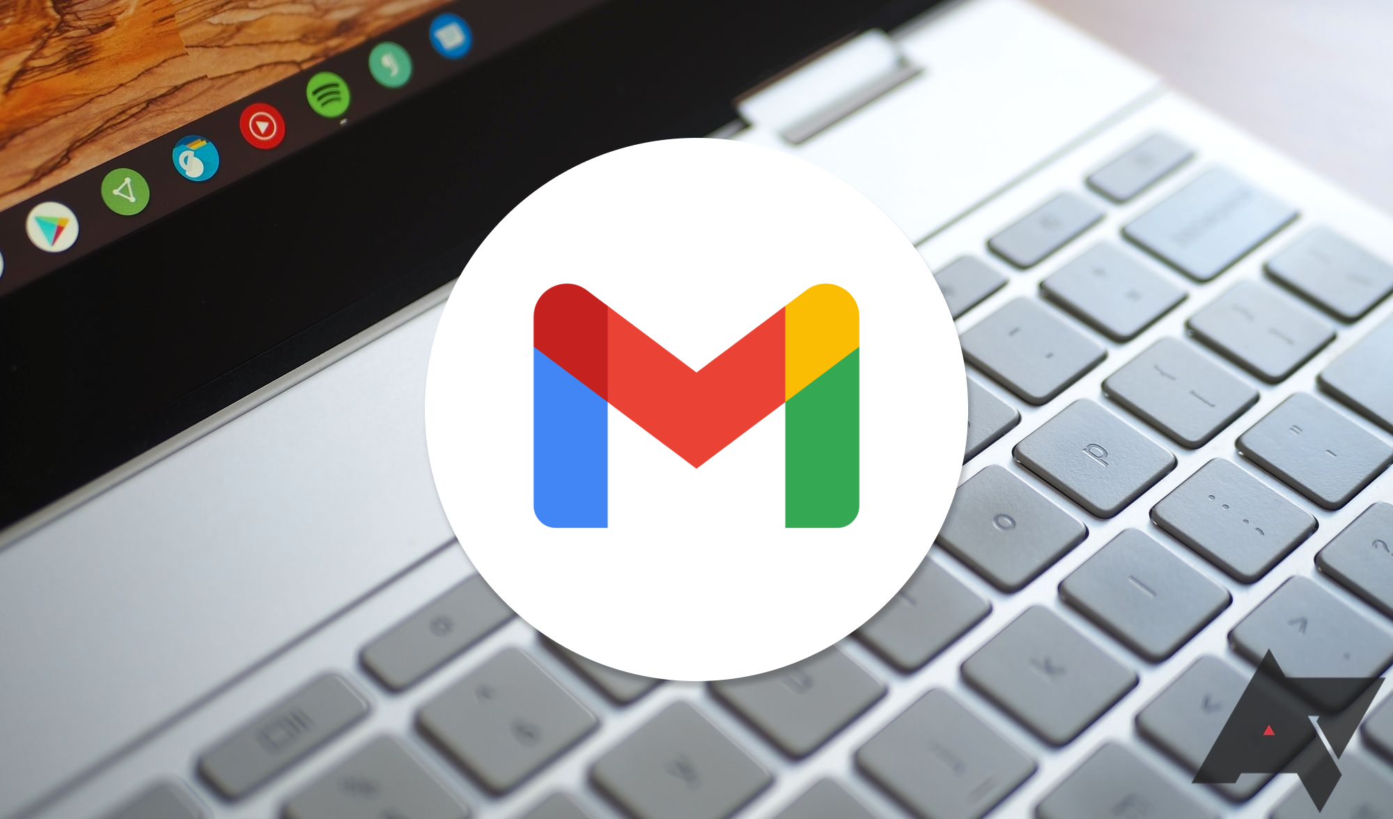 Um teclado do Chromebook com o logotipo do Gmail sobreposto