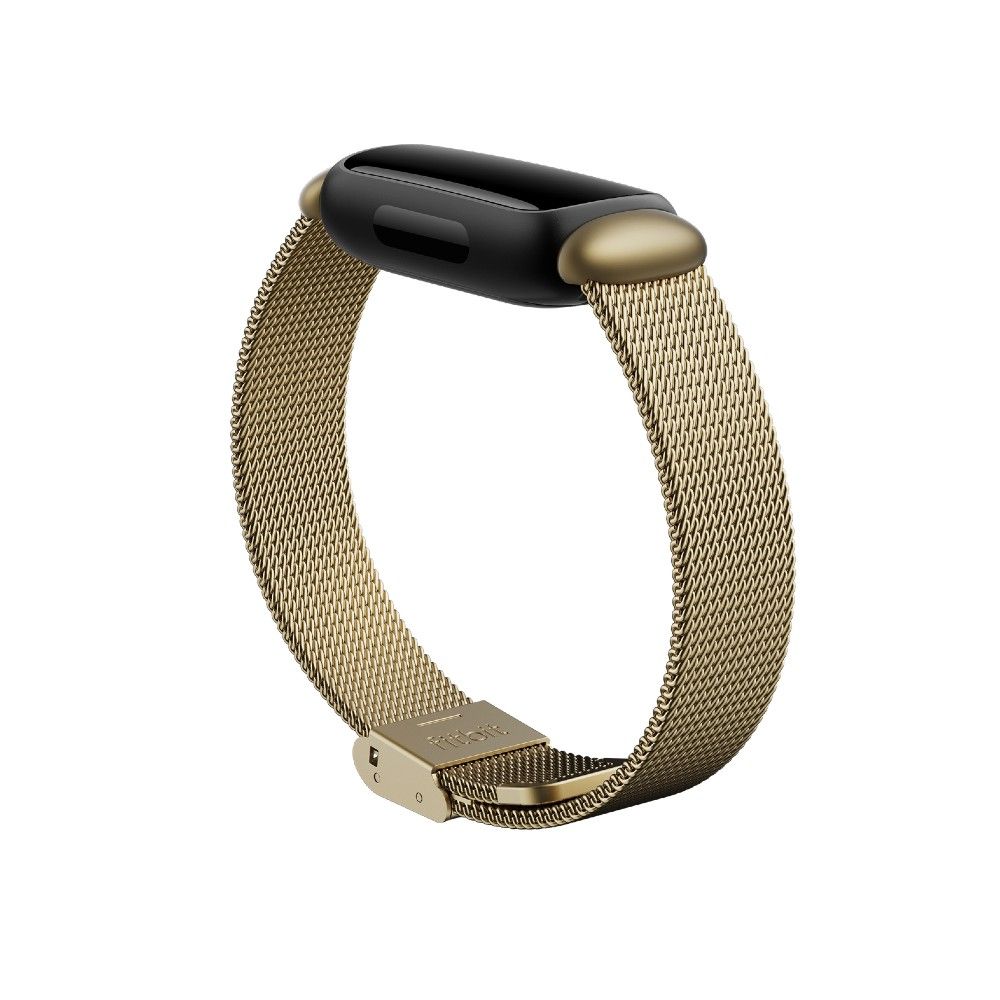 Um Fitbit Inspire 3 com uma faixa de malha de aço inoxidável dourada macia