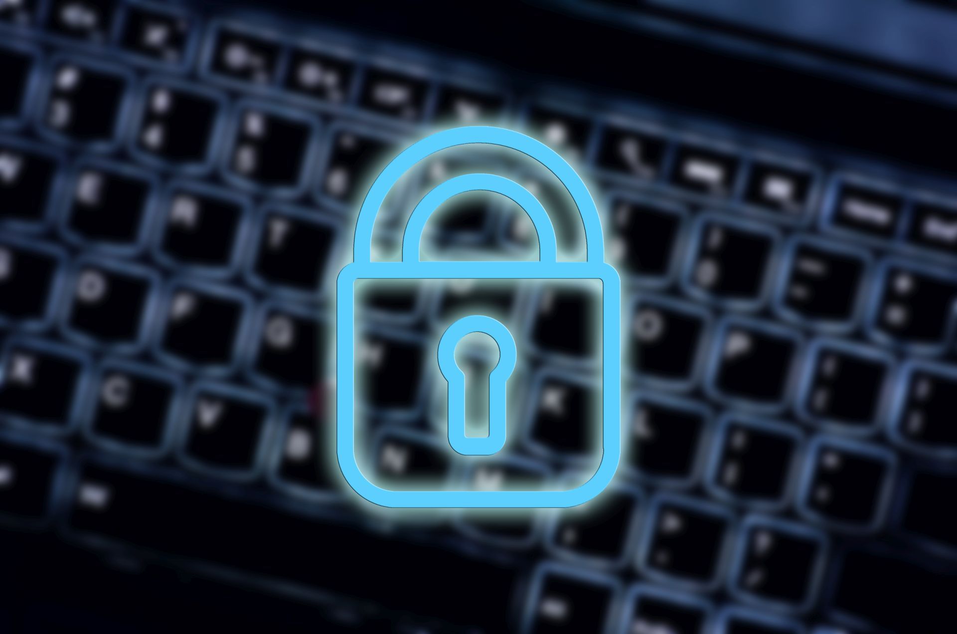 Um cadeado de segurança neon aparece sobre o fundo desfocado de um teclado retroiluminado