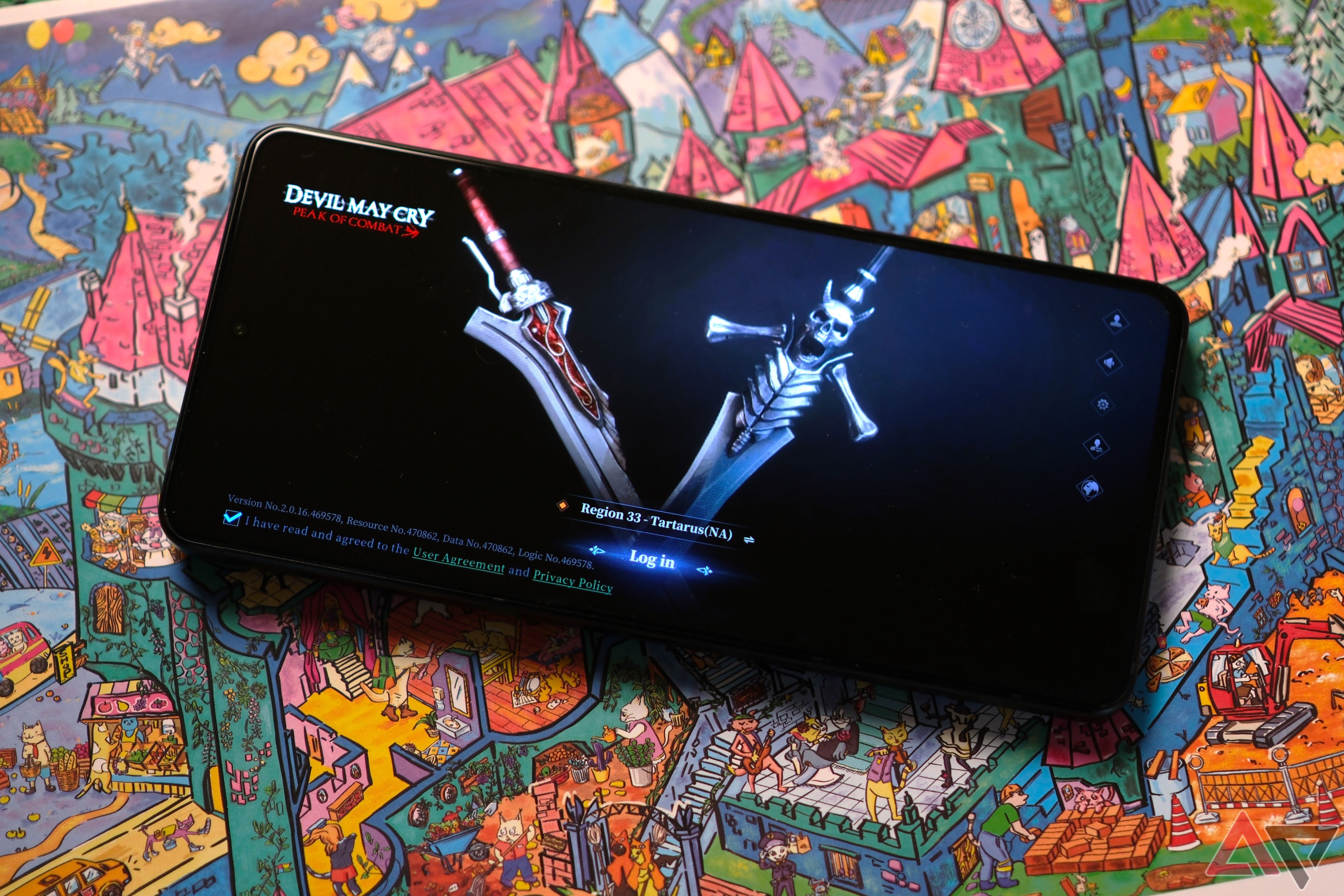 ROG Phone 8 Pro jogando Devil May Cry enquanto está deitado em um desenho colorido