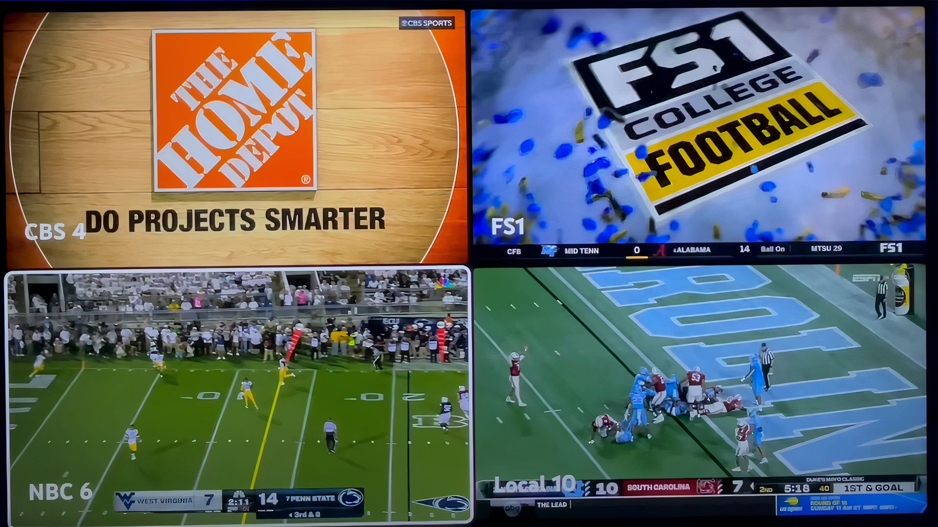 Uma tela de TV exibindo quatro transmissões esportivas simultaneamente.  a visualização inferior esquerda possui bordas brancas, indicando que é a visualização com áudio.