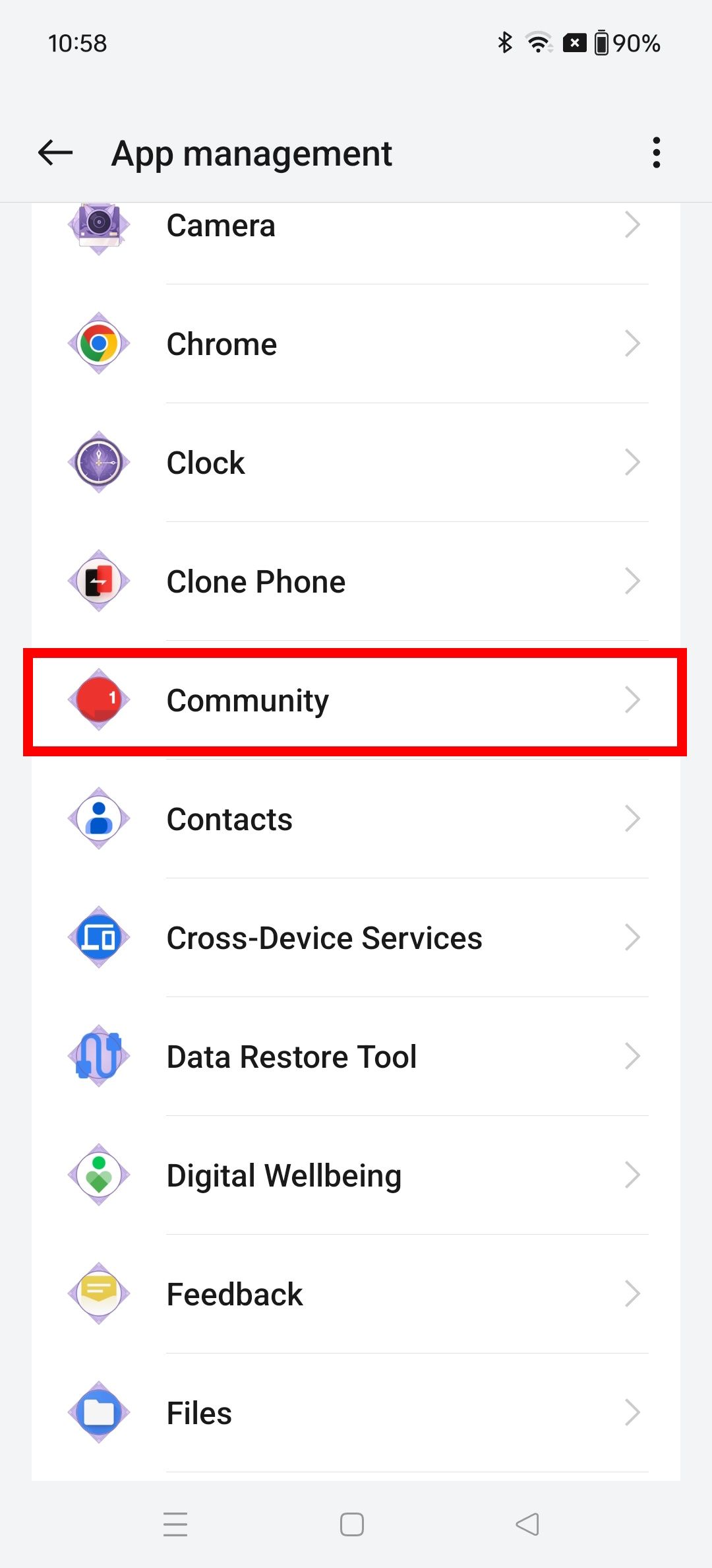 Contorno de retângulo vermelho sobre o aplicativo Comunidade no gerenciamento de aplicativos em um telefone OnePlus