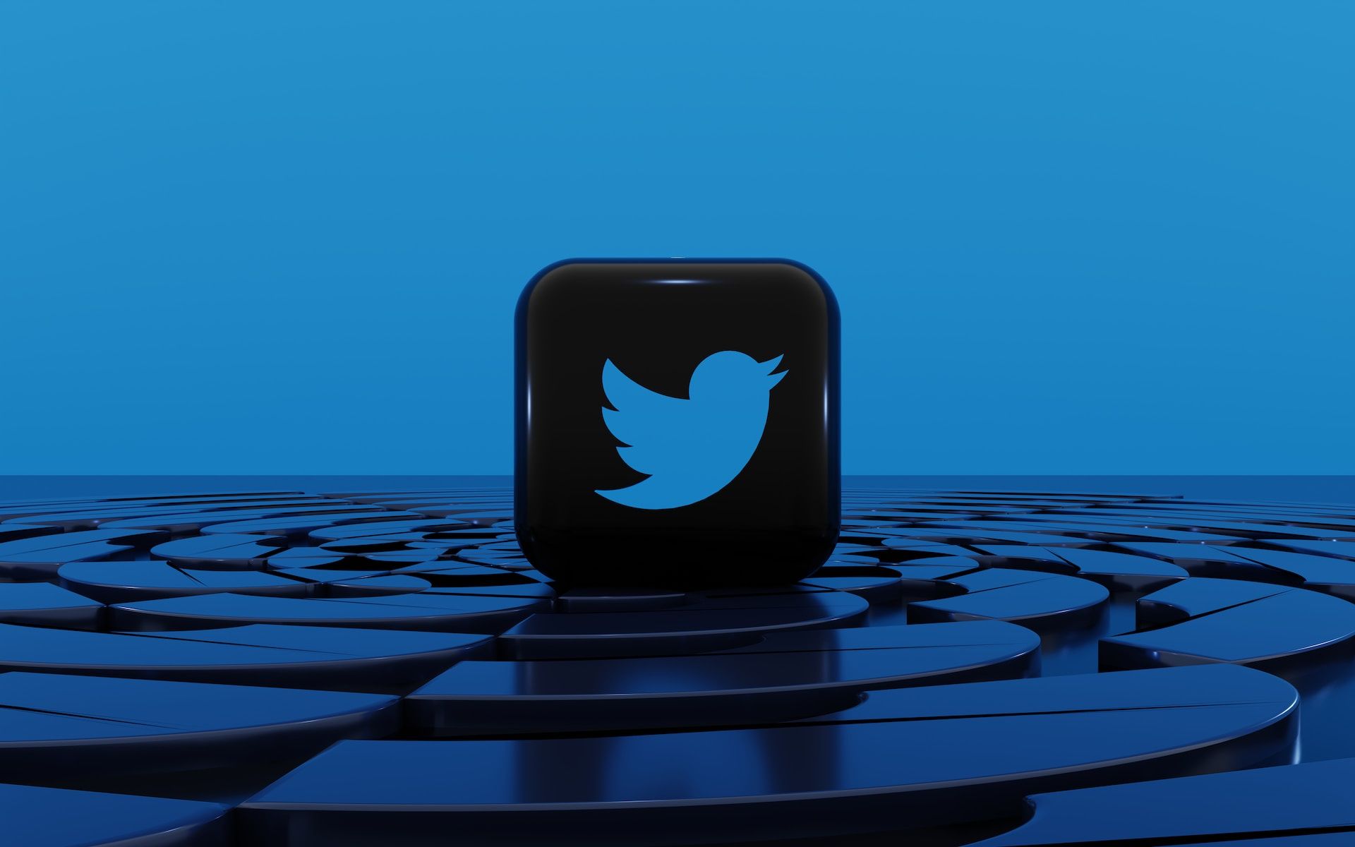 Logotipo do Twitter dentro de um quadrado preto em um fundo azul