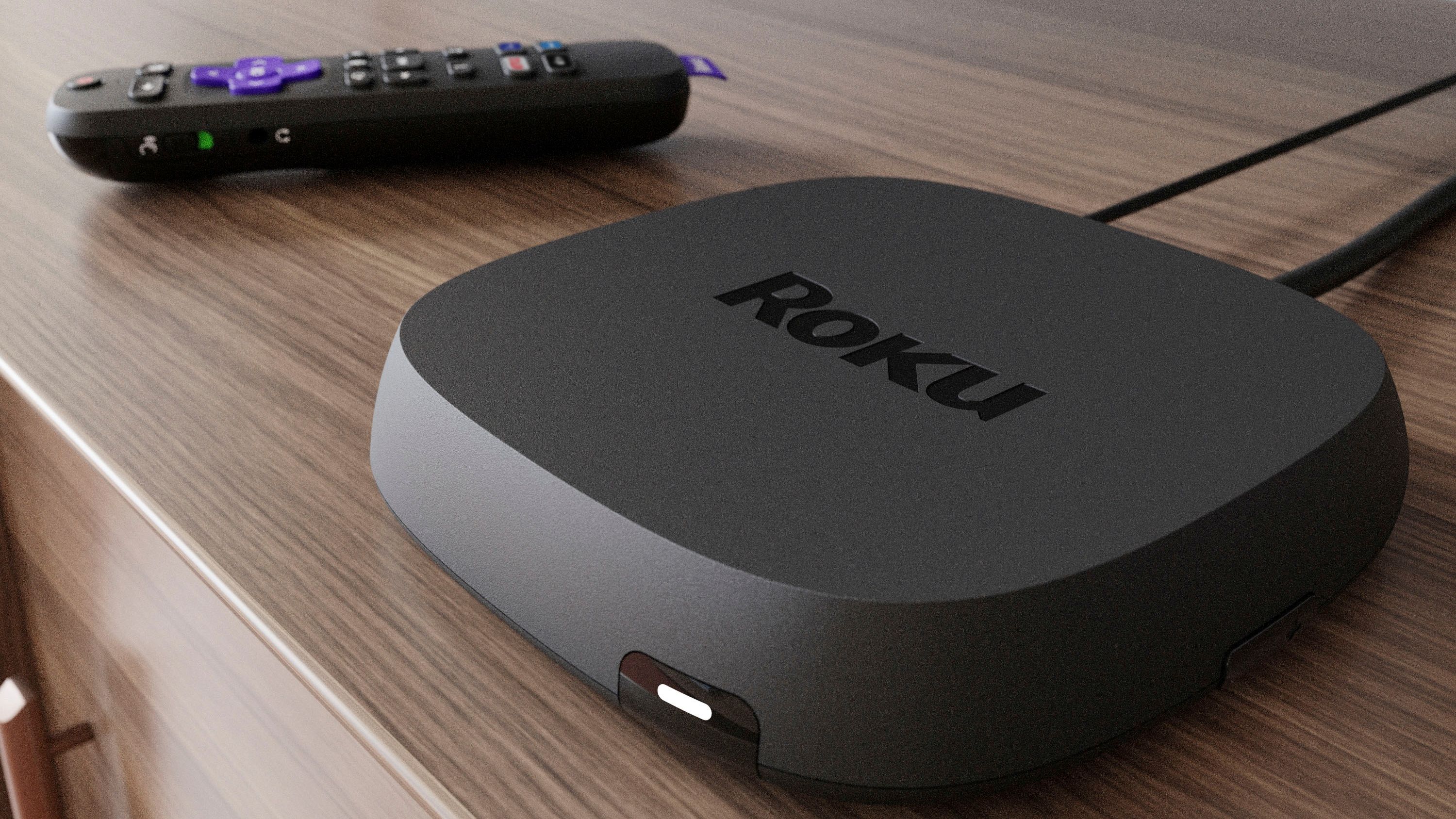 roku ultra com controle remoto em um gabinete