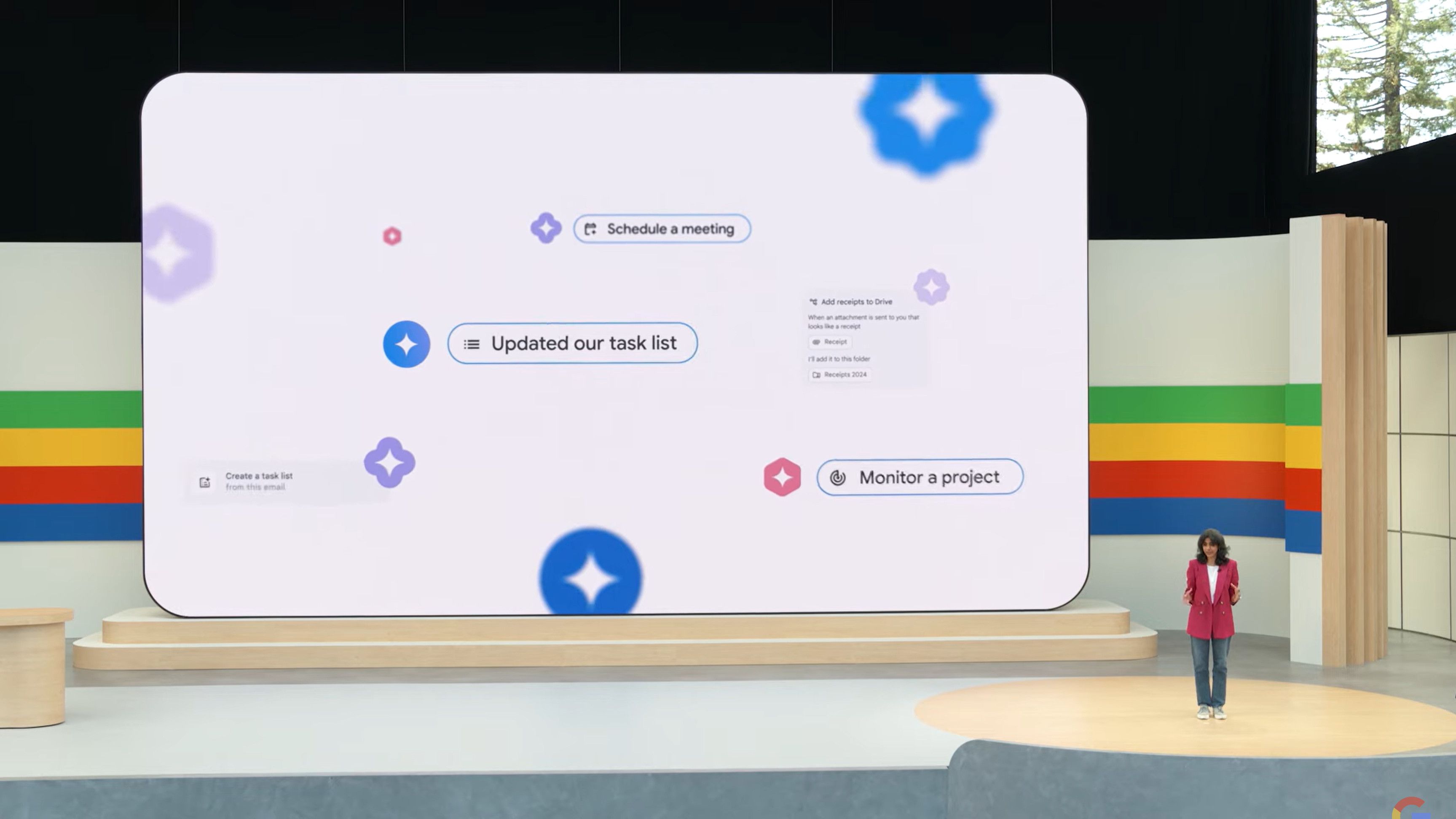 um palco e um grande display apresentando o companheiro de equipe do Google AI 